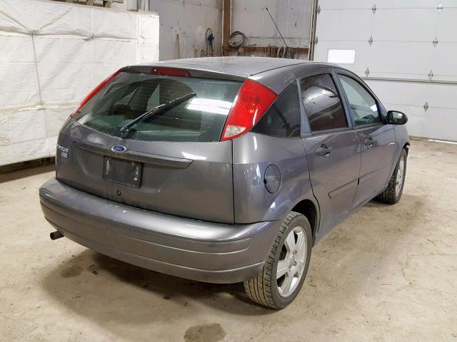 1FAHP37NX7W260811 - 2007 FORD FOCUS ZX5 GRAY photo 4