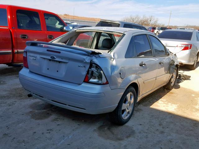 1FAHP34N95W196049 - 2005 FORD FOCUS ZX4 SILVER photo 4