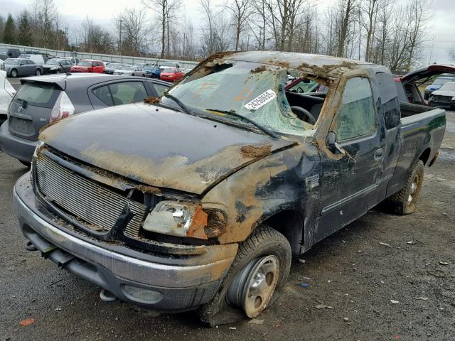 2FTRX18W04CA36786 - 2004 FORD F-150 HERI BLACK photo 2