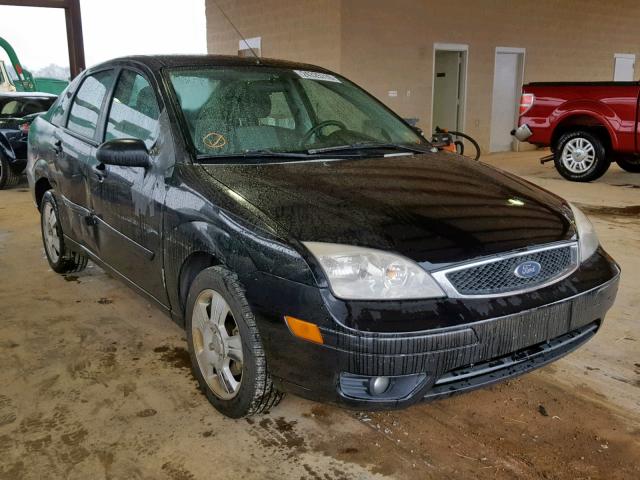 1FAFP34NX7W304981 - 2007 FORD FOCUS ZX4 BLACK photo 1