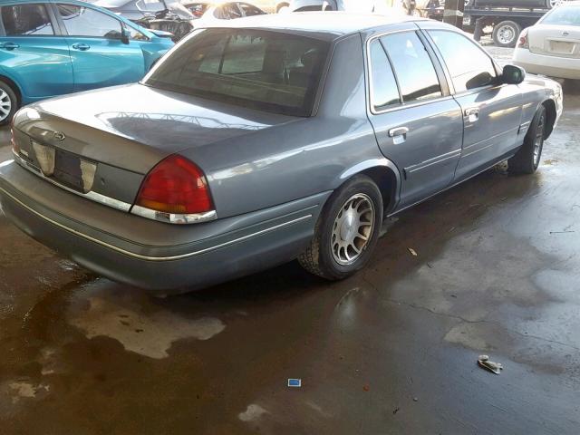 2FAFP74W9XX122564 - 1999 FORD CROWN VICT GRAY photo 4