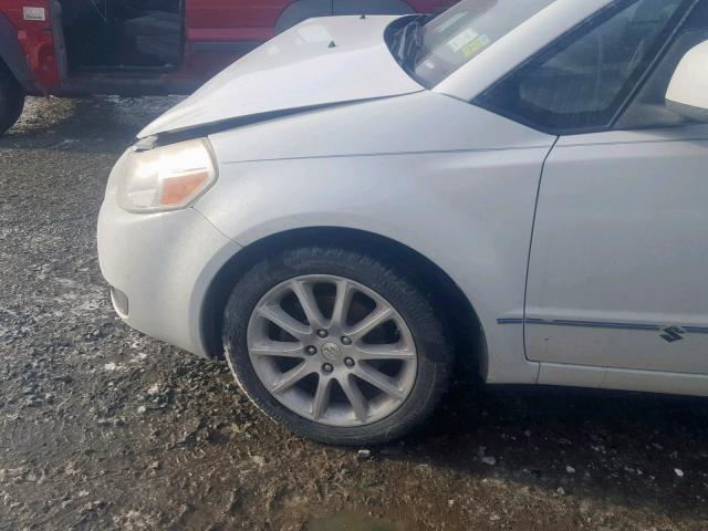 JS2YC5A26B6304561 - 2011 SUZUKI SX4 LE WHITE photo 9