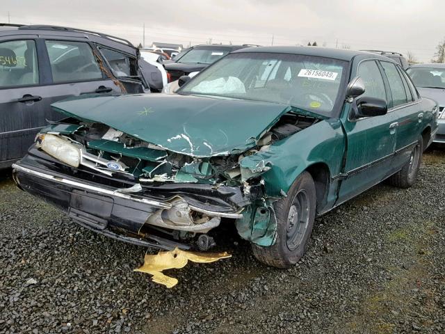 2FALP71WXVX150782 - 1997 FORD CROWN VICT GREEN photo 2