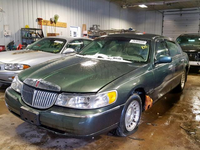 1LNHM81W6XY714554 - 1999 LINCOLN TOWN CAR E GREEN photo 2