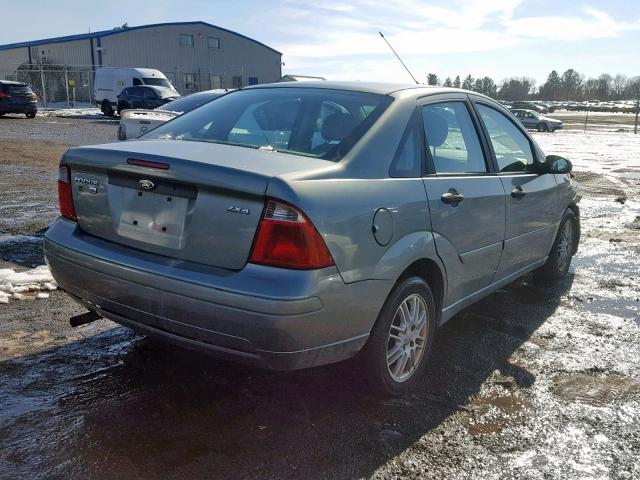 1FAFP34NX5W190624 - 2005 FORD FOCUS ZX4 SILVER photo 4