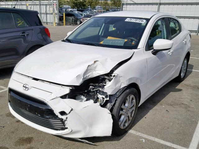 3MYDLBZV3GY115244 - 2016 TOYOTA SCION IA WHITE photo 2