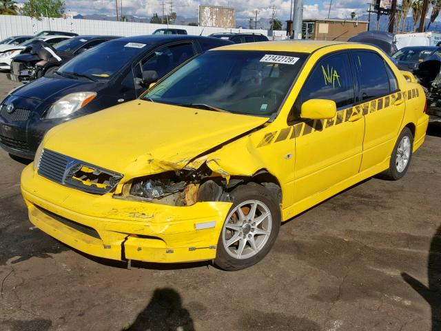 JA3AJ86E22U027309 - 2002 MITSUBISHI LANCER OZ YELLOW photo 2