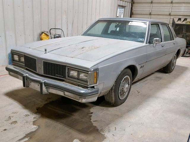 1G3AY69Y3EM708283 - 1984 OLDSMOBILE DELTA 88 R GRAY photo 2