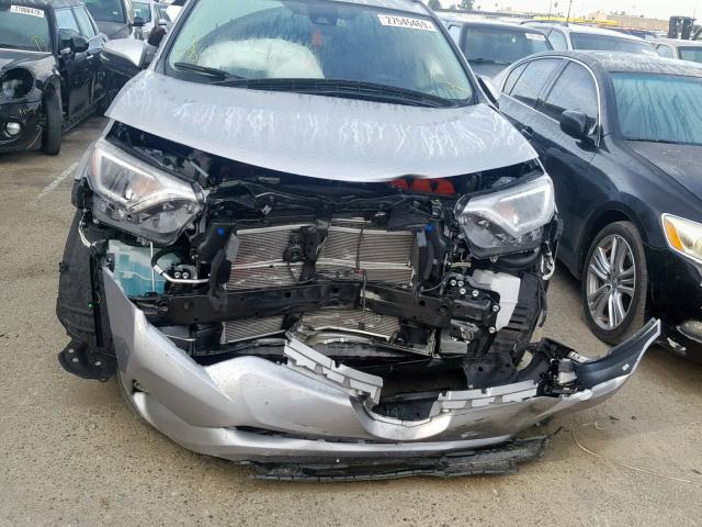 JTMRJREV2JD231165 - 2018 TOYOTA RAV4 HV LE SILVER photo 9