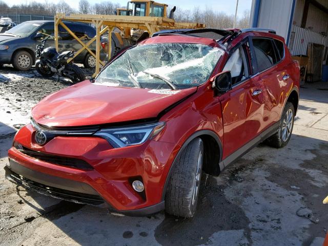 JTMDFREV4GJ058299 - 2016 TOYOTA RAV4 LIMIT RED photo 2