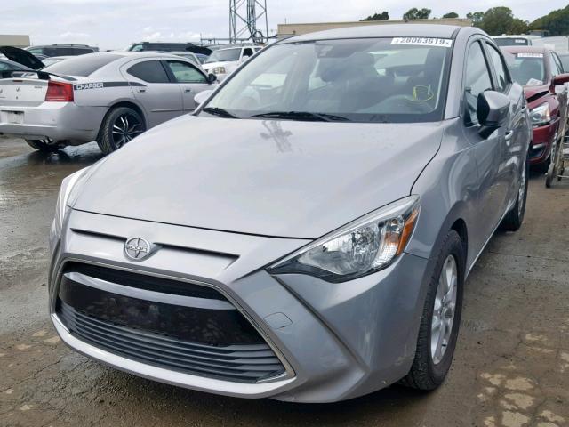 3MYDLBZV5GY137441 - 2016 TOYOTA SCION IA SILVER photo 2