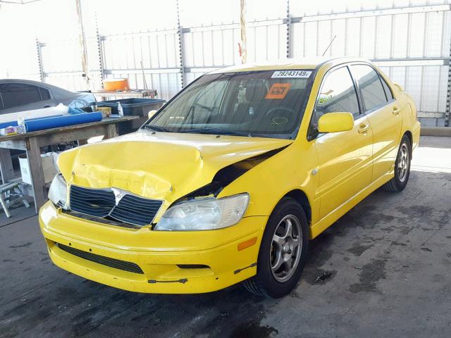 JA3AJ86E92U032930 - 2002 MITSUBISHI LANCER OZ YELLOW photo 2