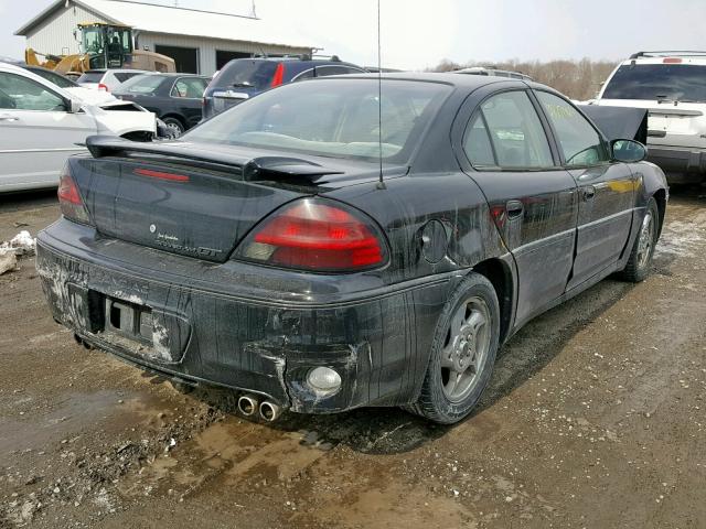 1G2NW52EX2M712915 - 2002 PONTIAC GRAND AM G BLACK photo 4