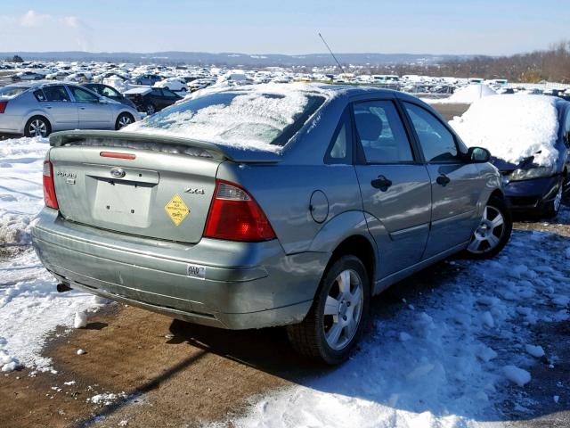 1FAFP34N45W158428 - 2005 FORD FOCUS ZX4 SILVER photo 4