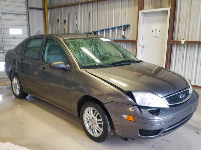 1FAHP34N27W173585 - 2007 FORD FOCUS ZX4 GRAY photo 1