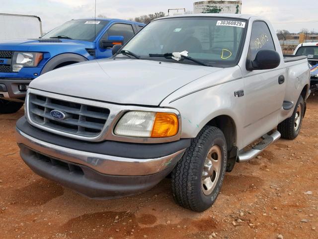 2FTRF07264CA24203 - 2004 FORD F-150 HERI SILVER photo 2