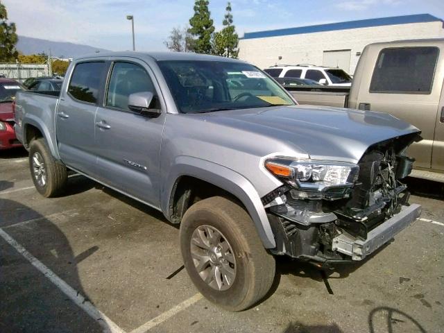 3TMAZ5CN2JM064585 - 2018 TOYOTA TACOMA DOU SILVER photo 1