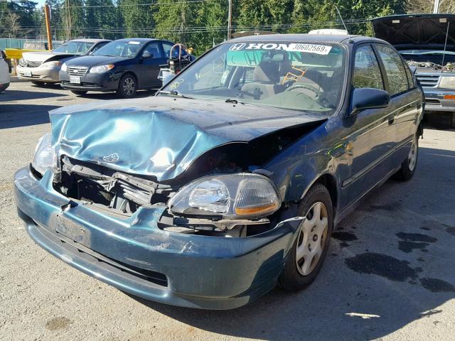 1HGEJ6621VL004564 - 1997 HONDA CIVIC DX GREEN photo 2