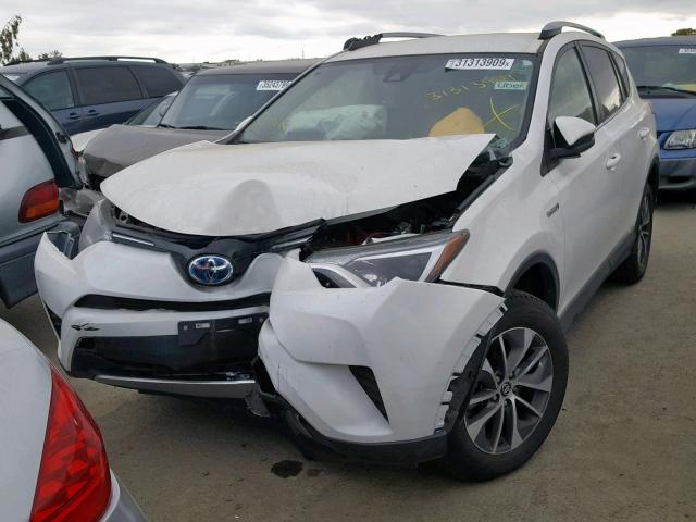 JTMRJREV6JD229449 - 2018 TOYOTA RAV4 HV LE WHITE photo 2