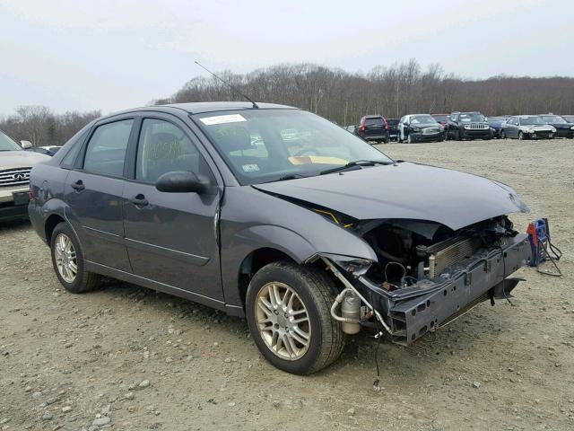 1FAFP34NX7W121483 - 2007 FORD FOCUS ZX4 GRAY photo 1