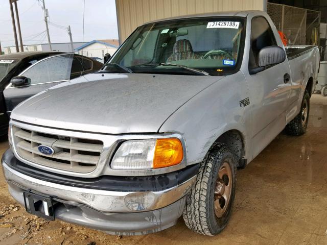 2FTRF17224CA25824 - 2004 FORD F-150 HERI SILVER photo 2