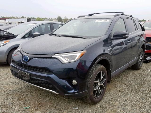 JTMJJREV2HD080108 - 2017 TOYOTA RAV4 HV SE BLACK photo 2