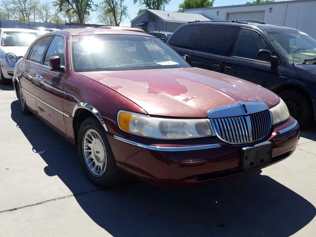 1LNHM83W0XY720573 - 1999 LINCOLN TOWN CAR C BURGUNDY photo 1