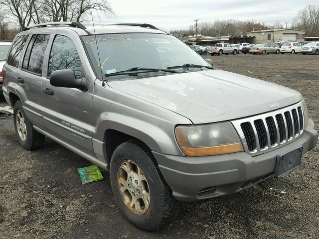 1J4GW58S5XC670842 - 1999 JEEP GRAND CHER GRAY photo 1