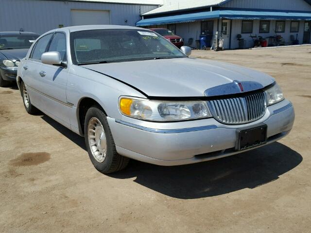 1LNHM81W8XY673425 - 1999 LINCOLN TOWN CAR E GRAY photo 1