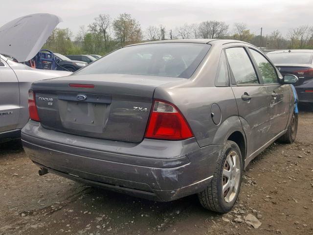 1FAFP34N85W273162 - 2005 FORD FOCUS ZX4 GRAY photo 4