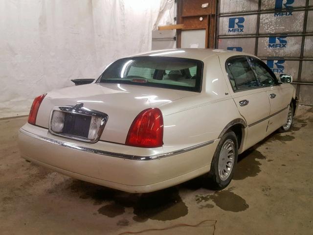 1LNHM83W8XY690576 - 1999 LINCOLN TOWN CAR C BEIGE photo 4