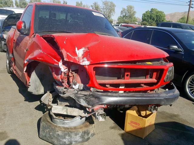 2FTZF07311CA41818 - 2001 FORD F150 SVT L RED photo 1