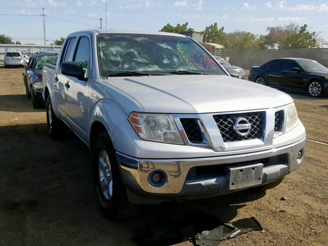 1N6AD07U79C410658 - 2009 NISSAN FRONTIER C SILVER photo 1