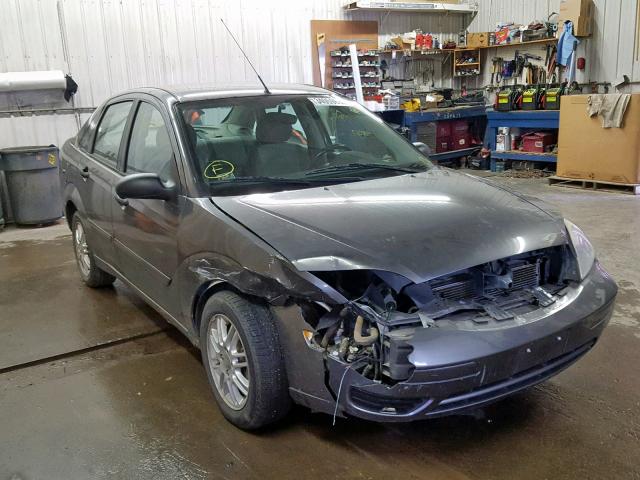 1FAFP34N25W109406 - 2005 FORD FOCUS ZX4 GRAY photo 1