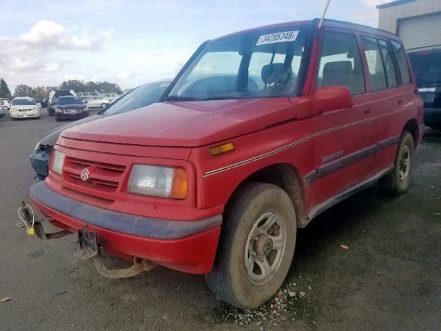 2S3TD03V7V6403904 - 1997 SUZUKI SIDEKICK J RED photo 2