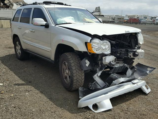 1J8HS58P49C512716 - 2009 JEEP GRAND CHER SILVER photo 1