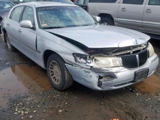 1LNHM83W2XY614870 - 1999 LINCOLN TOWN CAR C GRAY photo 1