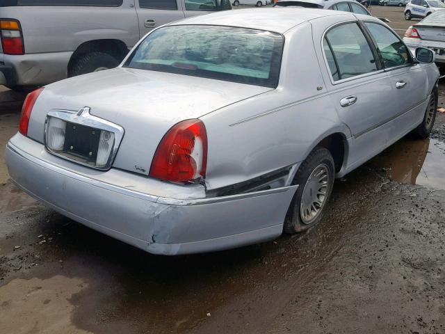 1LNHM83W2XY614870 - 1999 LINCOLN TOWN CAR C GRAY photo 4