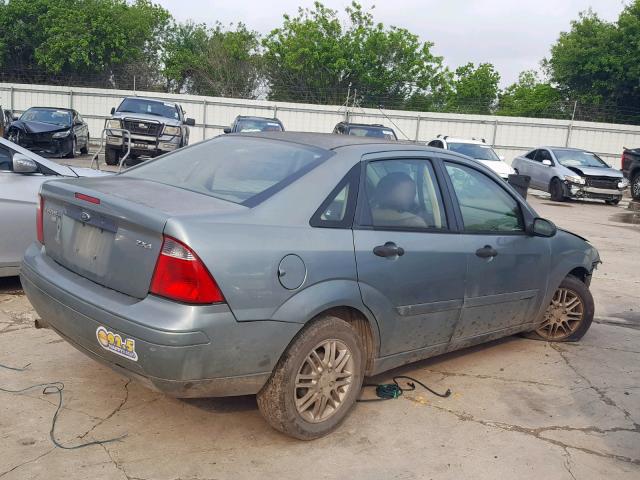 1FAFP34N65W261544 - 2005 FORD FOCUS ZX4 GREEN photo 4