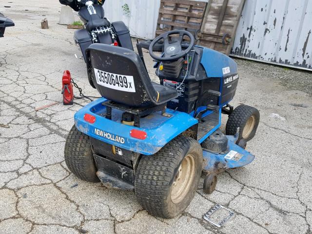 T6D0723 - 2009 NEWH TRACTOR BLUE photo 4