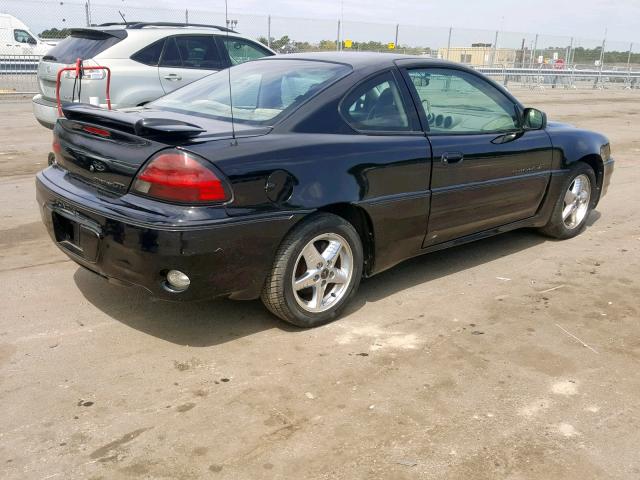 1G2NW12E61M563264 - 2001 PONTIAC GRAND AM G BLACK photo 4