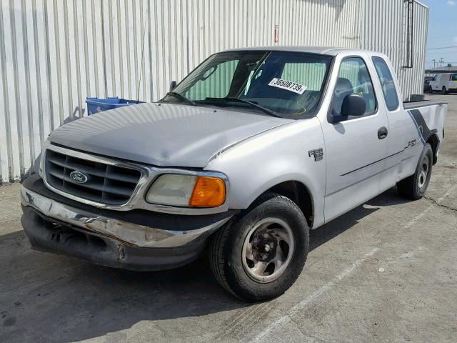 2FTRX17W04CA60524 - 2004 FORD F-150 HERI SILVER photo 2