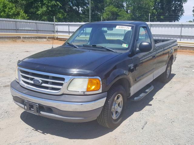 2FTRF17W34CA12843 - 2004 FORD F-150 HERI BLACK photo 2