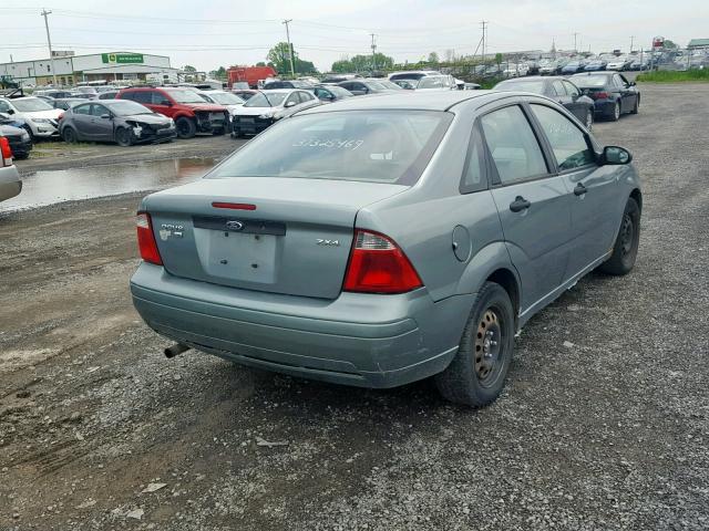 1FAFP34N95W208661 - 2005 FORD FOCUS ZX4 GREEN photo 4