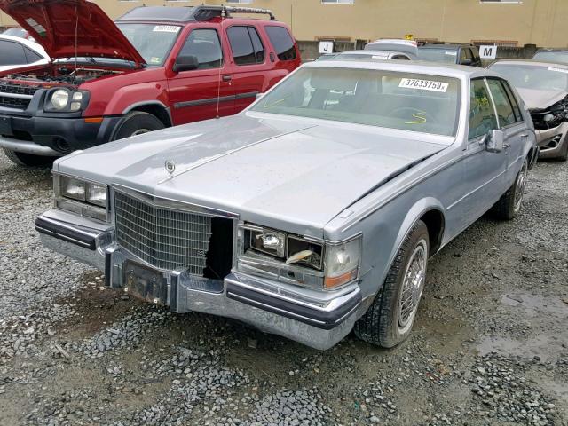 1G6KS6980FE824125 - 1985 CADILLAC SEVILLE SILVER photo 2