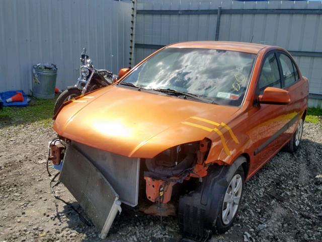 KNADE223496537144 - 2009 KIA RIO BASE ORANGE photo 2