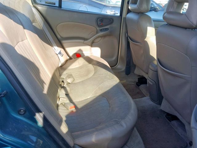 1G2NE52E8XM878831 - 1999 PONTIAC GRAND AM S GREEN photo 6