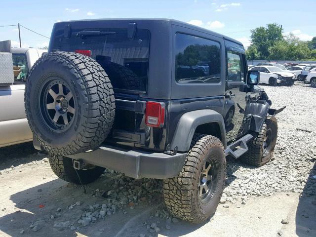 1J4AA2D10BL599252 - 2011 JEEP WRANGLER S შავი ფოტო 4
