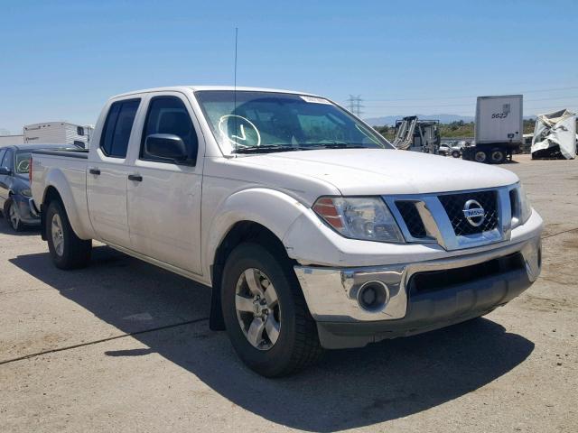 1N6AD09U79C427506 - 2009 NISSAN FRONTIER C WHITE photo 1