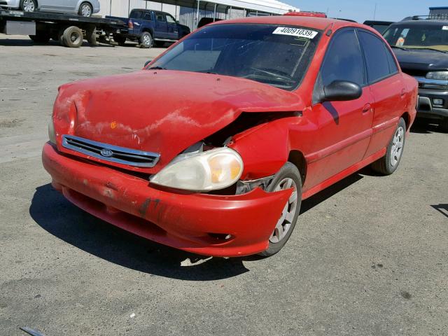 KNADC123126150198 - 2002 KIA RIO RED photo 2